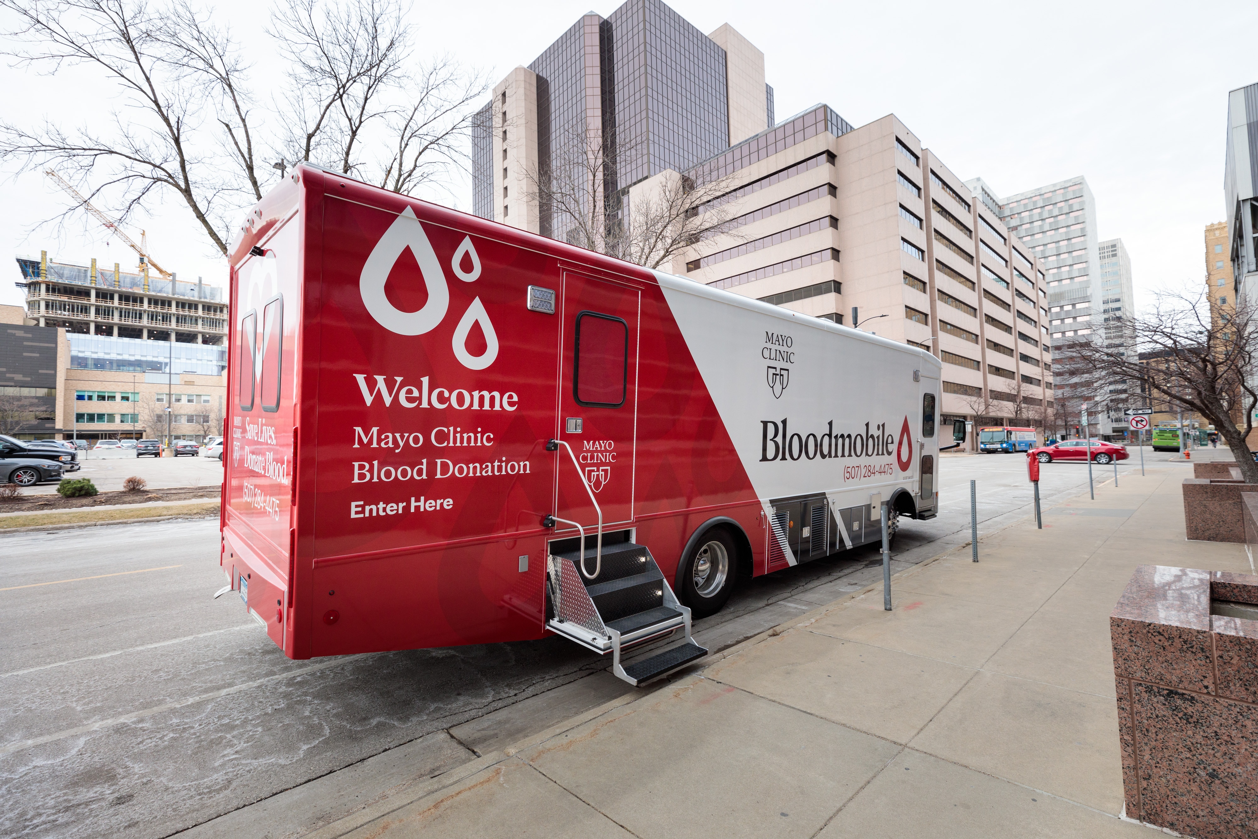 The Mayo Clinic Bloodmobile parked on a city street.